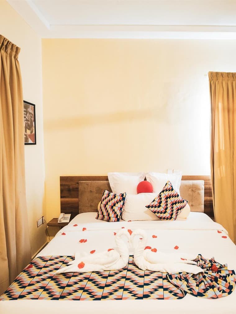 A Beachview Deluxe bedroom, queen bed beside the window