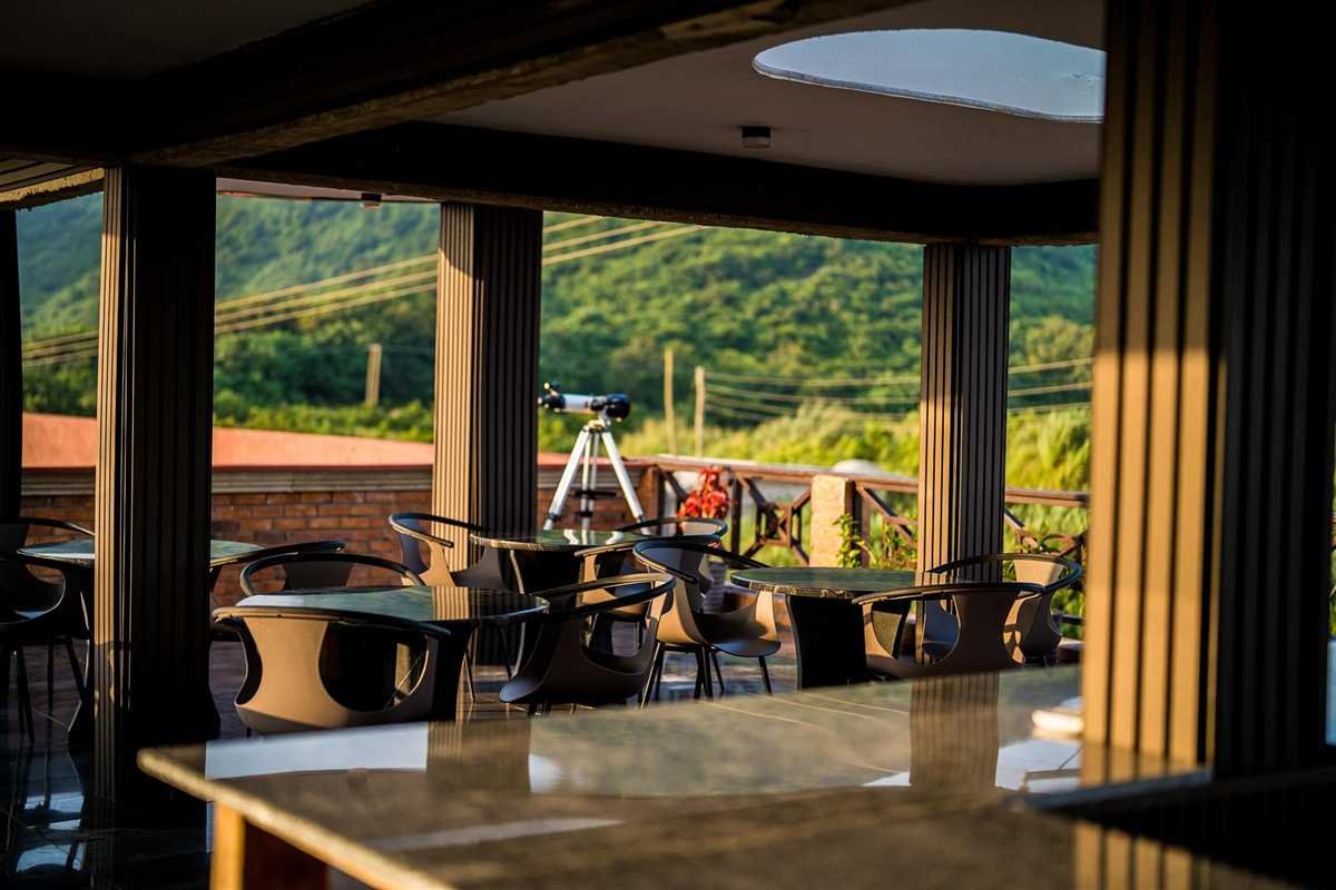 The rooftop lounge looking inland at the hills